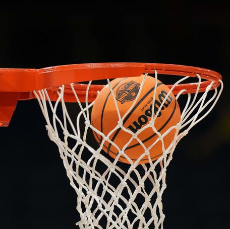 A Wilson EVO Nxt basketball ball with the 2025 NCAA Women's Final Four logo approaches the rim and the net at Amalie Arena.
