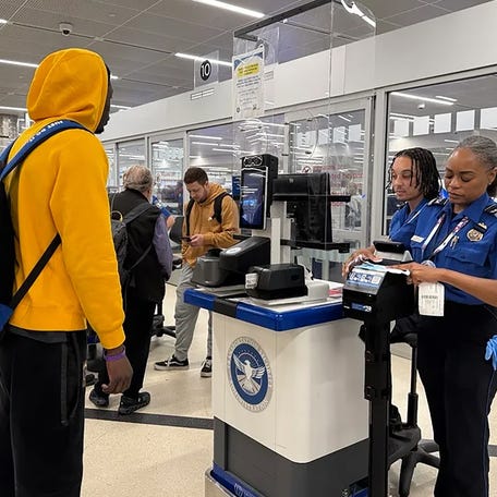 TSA agents check for REAL ID compliance at Hartsfield-Jackson Atlanta International Airport on May 7.