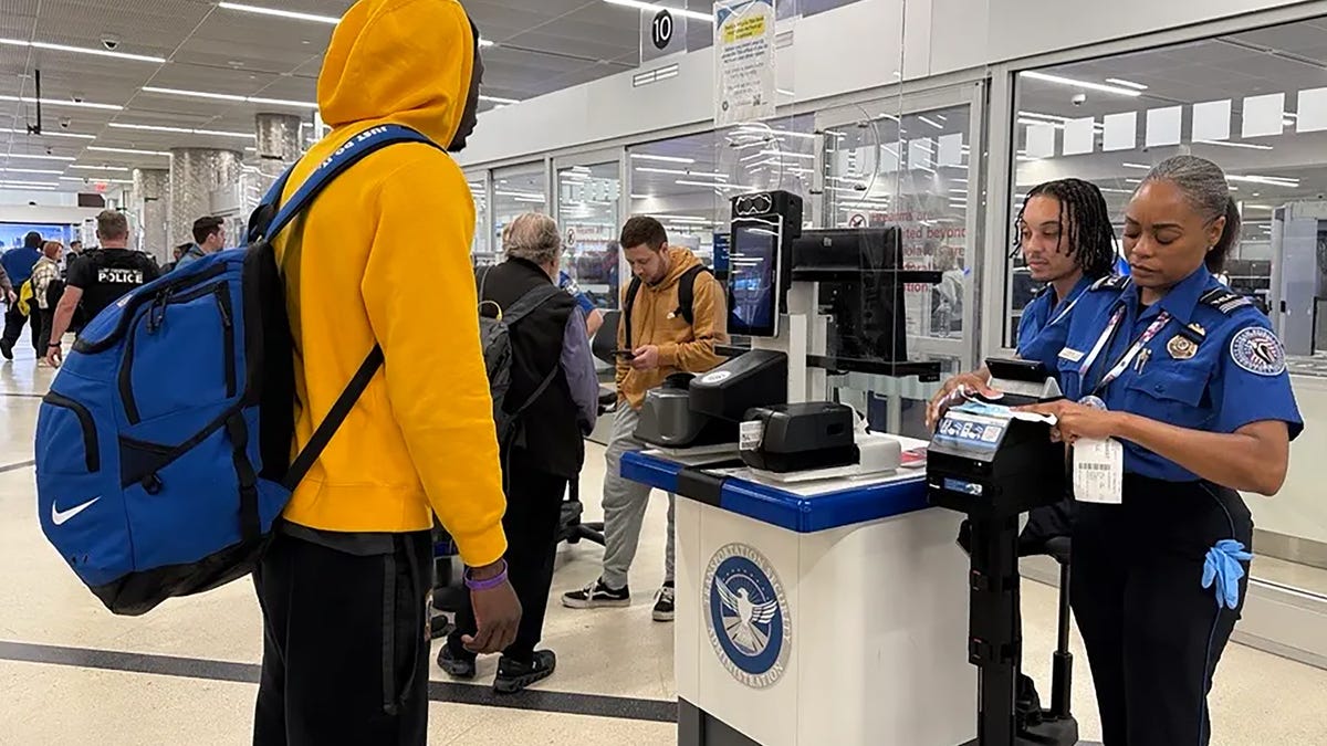 TSA agents check for REAL ID compliance at Hartsfield-Jackson Atlanta International Airport on May 7.
