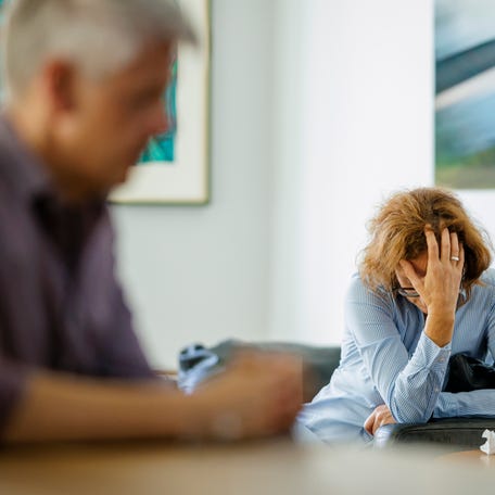 Photo Illustration of problems in a relationship. An older woman and an older man are sitting at home on August 13, 2024 in Berlin, Germany.