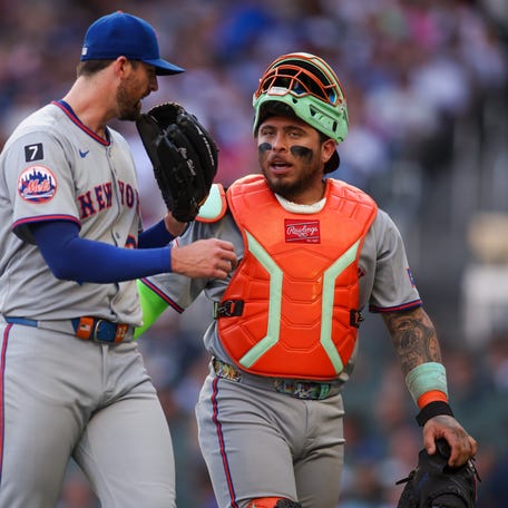 New York Mets starting pitcher Clay Holmes (35) talks to catcher Francisco Alvarez (4) against the Atlanta Braves after the first inning on June 19, 2025, at Truist Park.