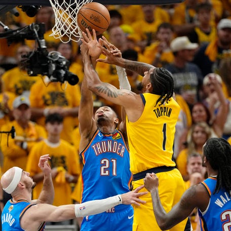 Thunder guard Aaron Wiggins (21) defends Pacers forward Obi Toppin (1) during the first half of Game 6 of the NBA Finals at Gainbridge Fieldhouse in Indianapolis on June 19, 2025.