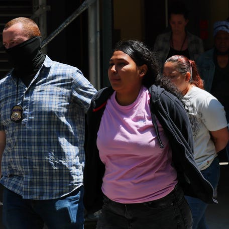 Federal agents escort detainees to vehicles after exiting an Intensive Supervision Appearance Program office on June 04, 2025 in New York City. Federal agents are arresting immigrants during mandatory check-ins, as ICE ramps up enforcement following immigration court hearings. Such arrests make immigrant survivors of domestic violence fear attending court hearings in their cases.
