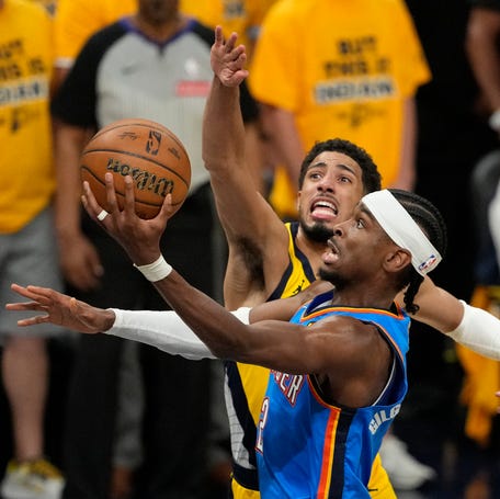 Thunder guard Shai Gilgeous-Alexander (2) shoots the ball against Pacers guard Tyrese Haliburton (0) during the first half of Game 3 of the NBA Finals at Gainbridge Fieldhouse in Indianapolis on June 11, 2025.