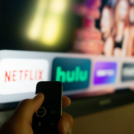Netflix and Hulu apps displayed on an Apple TV system.