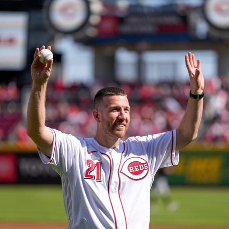Former Reds third baseman Todd Frazier waves to the crowd before throwing a ceremonial first pitch at Great American Ball Park in Cincinnati, Ohio on March 30, 2023.