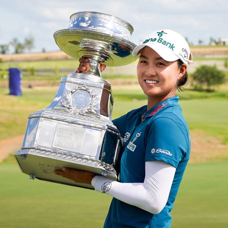 Minjee Lee poses with the trophy after winning the 2025 KPMG Women's PGA Championship.