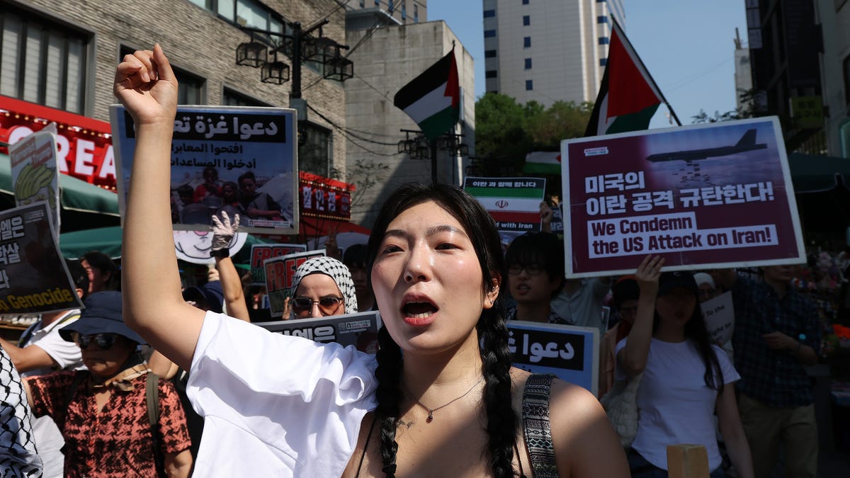 Protesters participate in a rally condemning the U.S. and Israeli missile strikes on Iran and in solidarity for Palestinians on June 22, 2025 in Seoul, South Korea. President Donald Trump spoke in a televised address following a strike on the three Iranian nuclear facilities by the U.S. military.