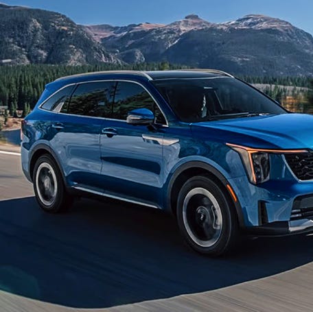 A blue 2025 Kia Sorento Hybrid midsize hybrid SUV