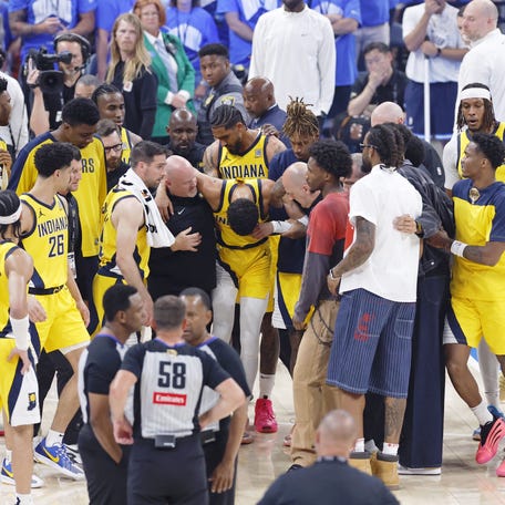 Indiana Pacers guard Tyrese Haliburton (0) is assisted after an apparent injury following a play against the Oklahoma City Thunder during the first half of game seven of the 2025 NBA Finals at Paycom Center in Oklahoma City, Oklahoma on June 22, 2025.