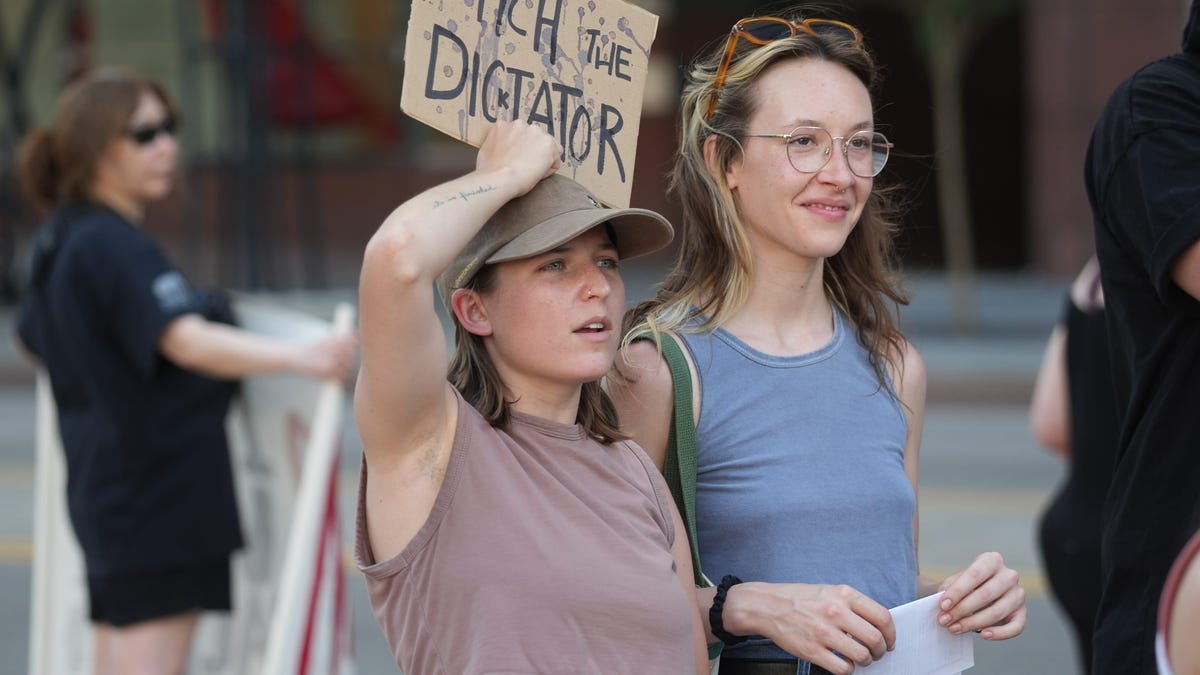 Attendees listen to speakers at the Stop the War on Iran protests planned by ANSWER Coalition and others at the Ohio Statehouse in Columbus, Ohio, on June 22, 2025.