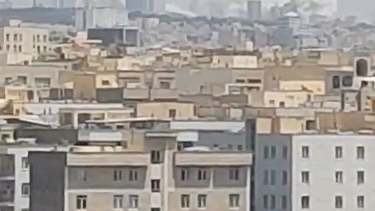 Plumes of smoke rise in Tehran, Iran, on June 23, 2025.