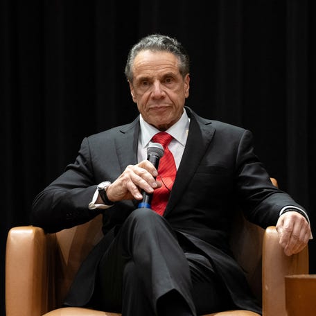 Mayoral candidate Andrew Cuomo sits on stage after protesters interrupted his speech during a Democratic mayoral forum at Medgar Evers College in New York City.
