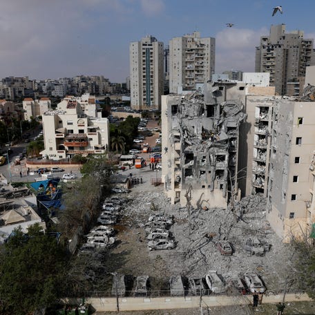 A residential site is damaged following a missile attack in Be'er Sheva, Israel.