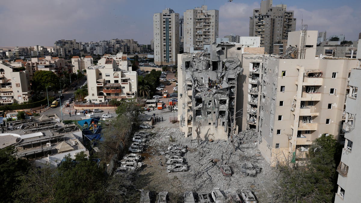 A residential site is damaged following a missile attack in Be'er Sheva, Israel.
