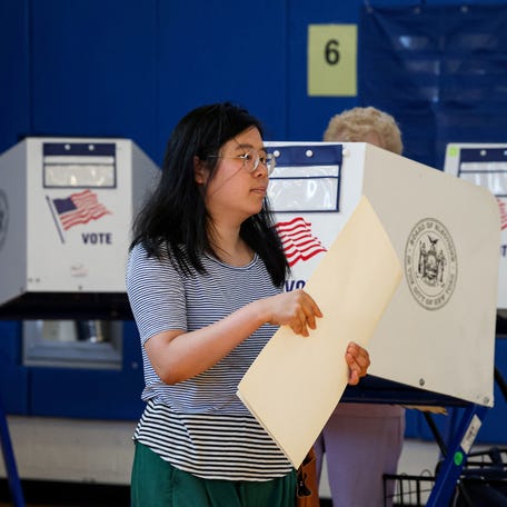 People vote in the primary election, which includes the race for the Democratic candidate for New York City mayor in the November's election, in the Brooklyn borough of New York City, June 24, 2025. New York Democrats cast ballots Tuesday under smothering summer heat to choose the likely next leader of the largest US city, someone voters say must resist President Donald Trump and provide relief to high costs of living. With about a dozen candidates offering a range of personalities and   proposals, the race is an increasingly tight contest between former governor Andrew Cuomo, 67, and state assemblyman Zohran Mamdani, 33, who has mounted a surprise challenge to the better-known but tainted frontrunner.
