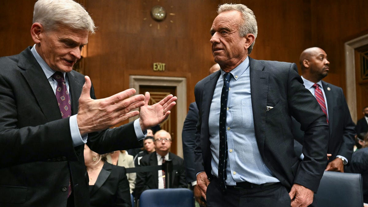US Secretary of Health and Human Services Robert F. Kennedy Jr., (R) speaks with committee chairman Senator Bill Cassidy, Republican from Louisiana, before the start of a Senate Committee on Health, Education, Labor, and Pensions hearing on the President's proposed budget request for fiscal year 2026 for the Department of Health and Human Services, on Capitol Hill in Washington, DC, May 14, 2025.