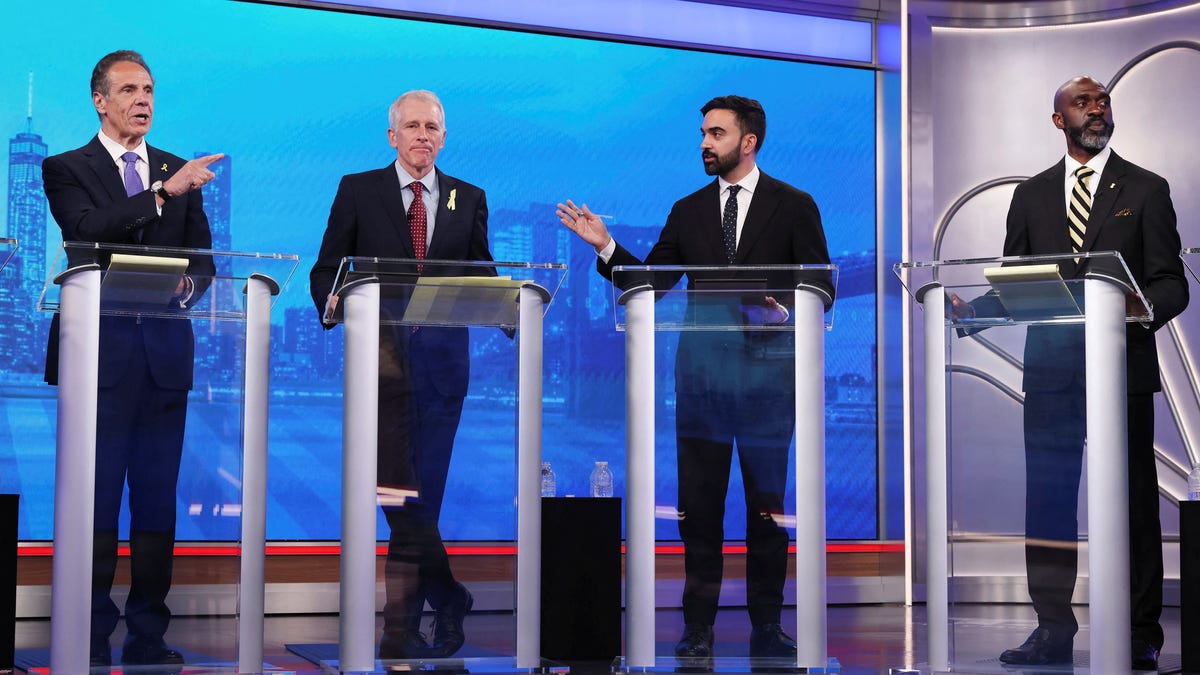 Democratic mayoral candidates Andrew Cuomo and Zohran Mamdani present arguments as Whitney Tilson and Michael Blake look on during a Democratic mayoral primary debate, Wednesday, June 4, 2025, in New York.  Yuki Iwamura/Pool via REUTERS