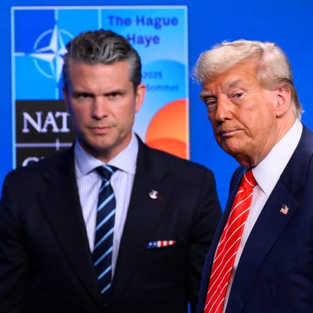 President Donald Trump, right, and Defense Secretary Pete Hegseth leave at the end of a press conference during the North Atlantic Treaty Organization (NATO) summit in The Hague on June 25, 2025.
