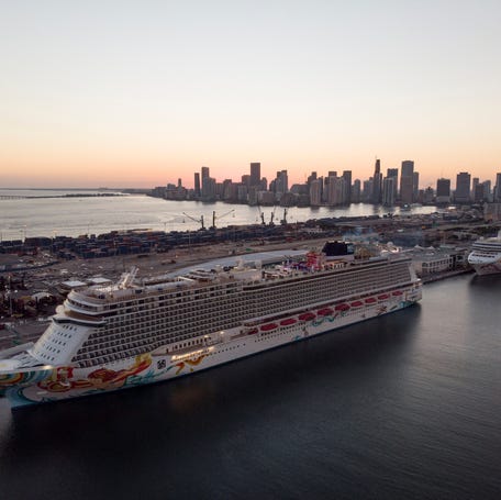 The Norwegian Getaway and the Norwegian Pearl cruise ships are seen docked in Miami, Florida on Jan. 5, 2022.