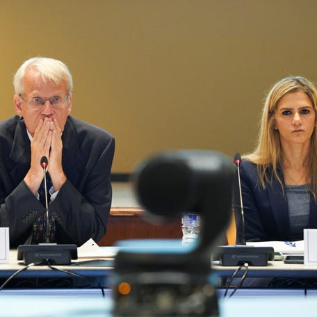 ACIP Chair Martin Kulldorff and Executive Secretary Mina Zadeh look on as people present their information to members of the Advisory Committee on Immunization Practices, as the CDC advisory panel for vaccines convenes in Atlanta on June 25, 2025.