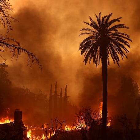 ALTADENA, CALIFORNIA - JANUARY 08: The Eaton Fire burns through a neighborhood on January 08, 2025 in Altadena, California. Fueled by intense Santa Ana Winds, the Eaton Fire has grown to over 10,000 acres and has destroyed many homes and businesses. (Photo by Justin Sullivan/Getty Images)