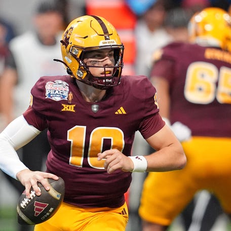 Arizona State Sun Devils quarterback Sam Leavitt (10) looks to pass the ball against the Texas Longhorns during the first half of the Peach Bowl at Mercedes-Benz Stadium.