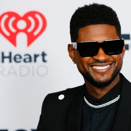 Usher poses as he arrives at the 2021 iHeartRadio Music Awards at Dolby Theatre in Los Angeles on May 27, 2021.