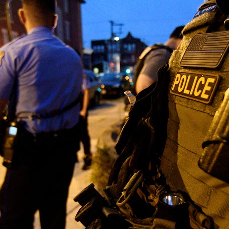 Police are seen during an active shooter situation, where Philadelphia police officers were shot during a drug raid on a home