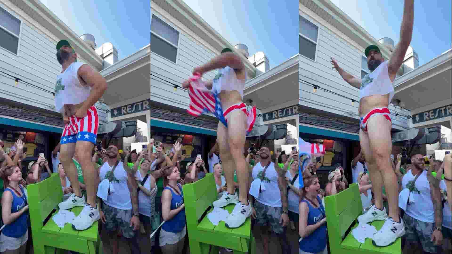 Watch as Jason Kelce rips off his patriotic shorts at an Eagles event