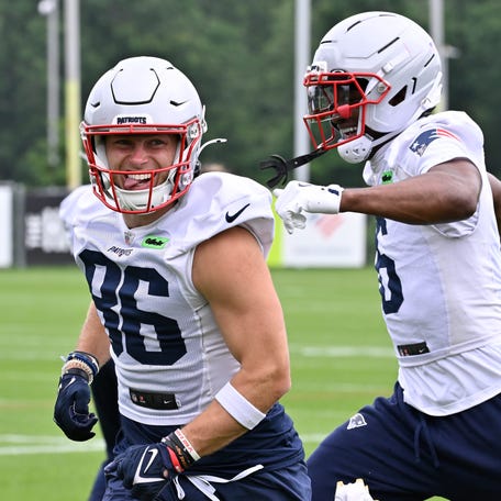 Jun 9, 2025; Foxborough, MA, USA; New England Patriots wide receiver Efton Chism III (86) reacts to beating wide receiver Javon Baker (6) in a drill during minicamp at Gillette Stadium. Mandatory Credit: Eric Canha-Imagn Images