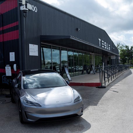 Tesla vehicles are parked outside a Tesla service center and gallery in Austin, Texas, U.S., June 21, 2025.