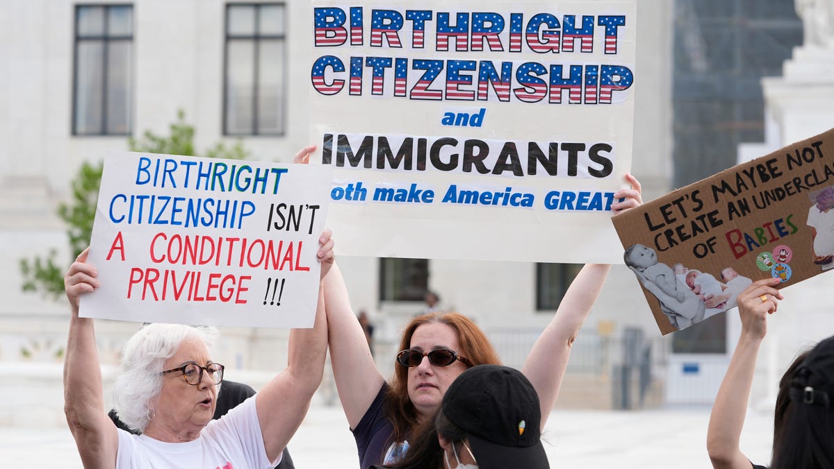 People rally outside the Supreme Court for birthright citizenship on May 15, 2025.