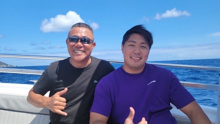 Sae Joon Park, 55, with his son.