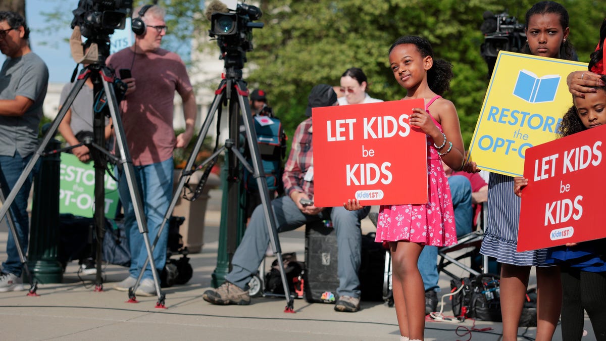 Children and supporters of parents demonstrate outside of the Supreme Court on April 22, 2025 in Washington, DC. Justices heard arguments from a coalition of Maryland parents who oppose requiring children to participate in classes that include LGBTQ themes.