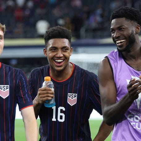 United States of America defender Alexander Freeman (16) and forward Patrick Agyemang (24) celebrate after winning a group stage match of the 2025 Gold Cup against Haiti at AT&T Stadium.