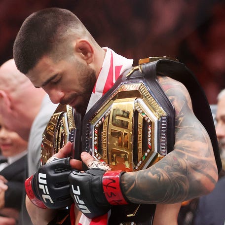 Ilia Topuria of Georgia looks on after knocking out Charles Oliveira of Brazil to win the lightweight main event title in the first round during UFC 317 at T-Mobile Arena on June 28, 2025 in Las Vegas, Nevada.