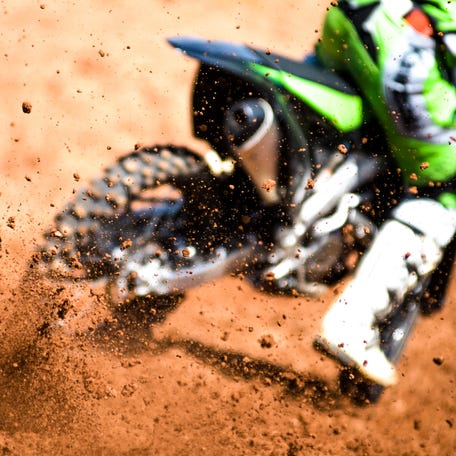 Motocross biker acellerating during a race