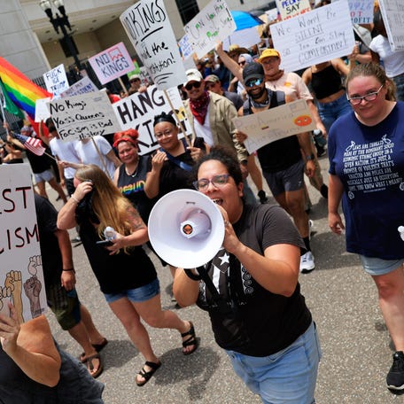 Maria Garcia of Jacksonville Immigrant Rights Alliance leads a protest march during a "No Kings" protest outside the Duval County Courthouse Saturday, June 14, 2025 in Jacksonville, Fla. People took part in one of nearly 2,000 nationwide rallies against Trump and his administration.