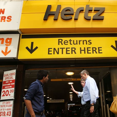 A Hertz car rental agency stands in Manhattan on June 30, 2016, in New York City. In an effort to expand its presence in the ride-hailing business, Hertz Global Holdings Inc. is expanding a car rental program to drivers working for Uber Technologies Inc. and Lyft Inc. Hertz currently has a network of 8,500 locations across the country.