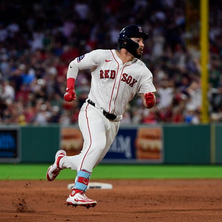 Boston Red Sox right fielder Wilyer Abreu rounds the bases after hitting an inside-the-park home run during the fifth inning against the Cincinnati Reds at Fenway Park.