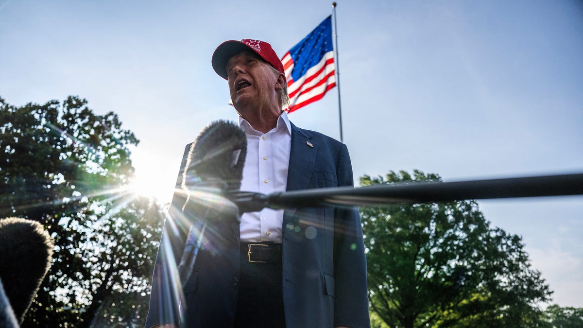 US President Donald Trump talks to members of the press as he departs from the South Lawn of the White House in Washington, DC on July 1, 2025. Trump is heading to Florida to visit "Alligator Alcatraz" immigrant detention center.