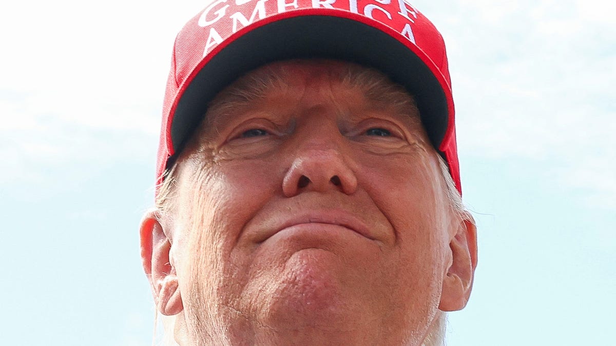 U.S. President Donald Trump smiles at the Dade-Collier Training and Transition Airport on the day of the opening of a temporary migrant detention center informally known as "Alligator Alcatraz" in Ochopee, Florida, U.S., July 1, 2025. REUTERS/Evelyn Hockstein