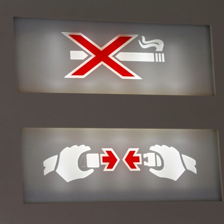 A "Fasten Your Seatbelt" and "No Smoking" sign is pictured in a Swiss Air Force Twin Otter aircraft in Belp near Bern, Switzerland, May 17, 2017.