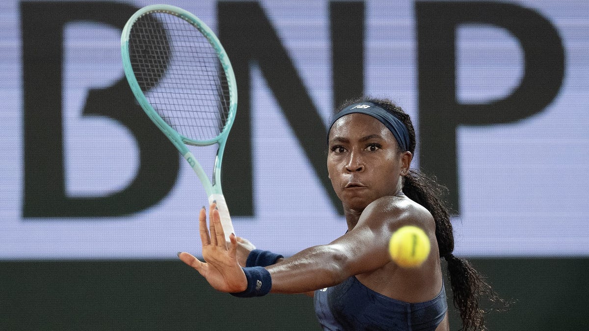 Coco Gauff of the United States returns a shot during her match against Lois Boisson of France on day 12 at Roland Garros Stadium.