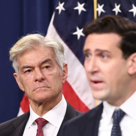 Dr. Mehmet Oz, administrator for the Centers for Medicare & Medicaid Services, listens as Matthew R. Galeotti, head of the Justice Department's Criminal Division, speaks about a healthcare fraud enforcement action during a press conference at the U.S. Department of Justice in Washington, D.C., June 30, 2025.