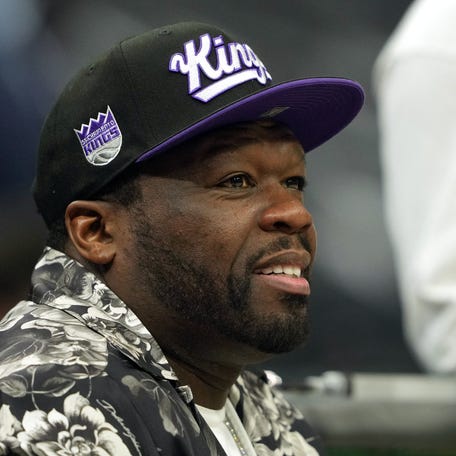 50 Cent sits courtside before the game between the Sacramento Kings and the Los Angeles Clippers at Golden 1 Center, April 11, 2025, in Sacramento, California.