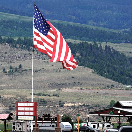 A giant American flag waves over the mountain town of Kremmling, Colorado, on Independence Day weekend 2025.