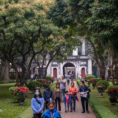 Tourists visit the Temple of Literature on March 25, 2023 in Hanoi, Vietnam.