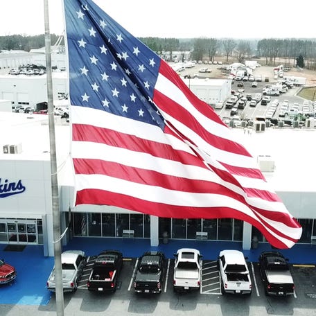 The U.S. flag flies over Akins Ford in Winder, Georgia. Akins Ford had great success with the "From America, For America" sales campaign Ford Motor Co. ran, pushing it to the number one selling Ford dealer in the nation for the second quarter. The campaign helped Ford brand to outsell Toyota and Chevrolet for the first half of the year.